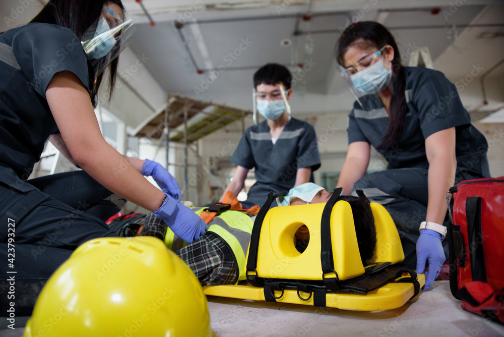 First aid for injuries in work accidents. Using first aid equipment