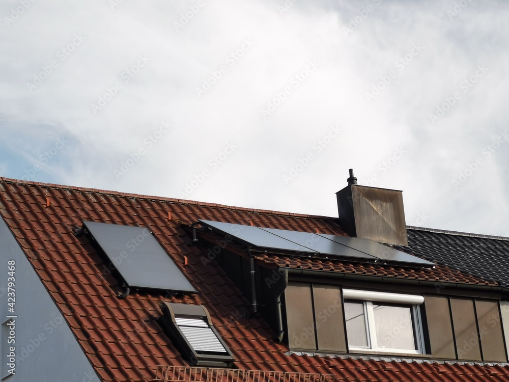 roof with solar panels and chimney