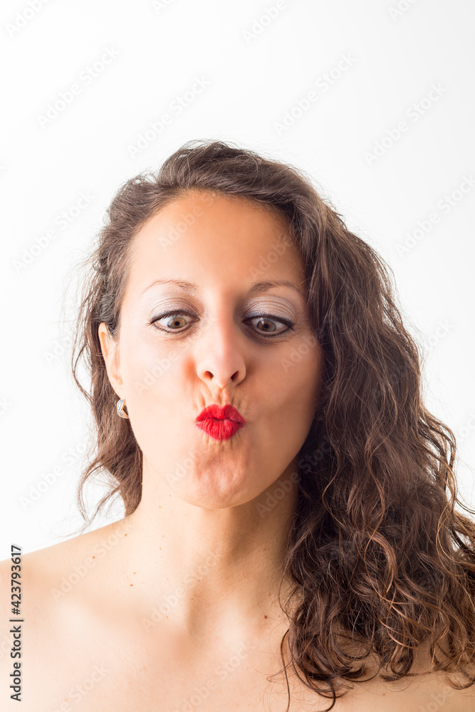 Portrait of a woman with red lips gesturing. Portrait of a woman with red lips gesturing.