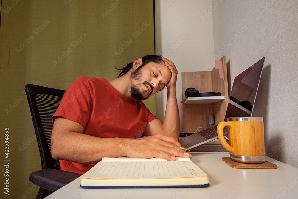 Young man working and studying at home. Home office man. Young man working and studying at home. Home office man.