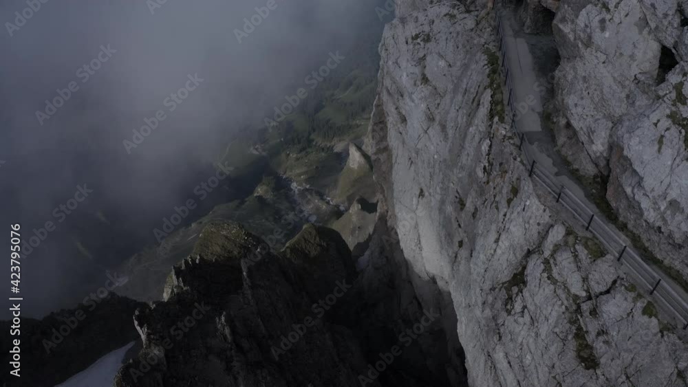 Aerial snowy mountain tops in the clouds Switzerland ungraded Aerial snowy mountain tops in the clouds Switzerland ungraded