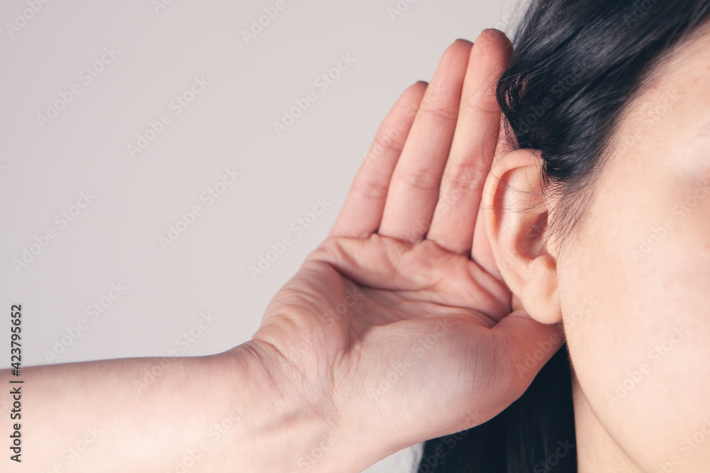 the girl carefully overhears other people's conversations the girl carefully overhears other people's conversations