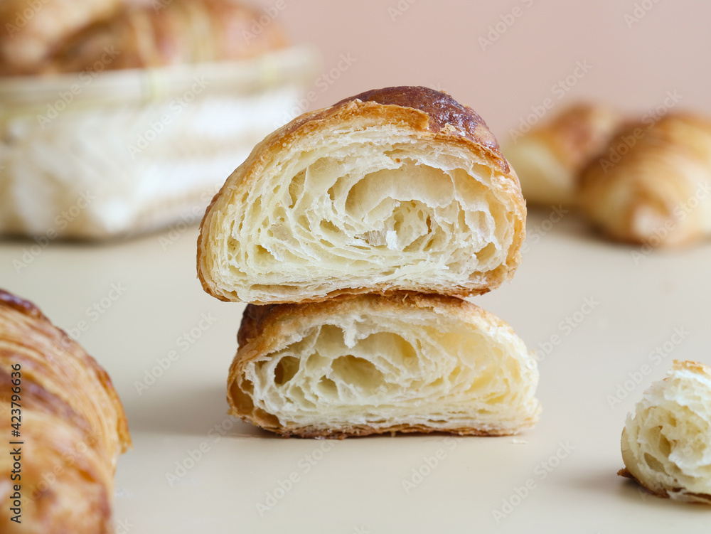 A cooked traditional French butter croissants cut to show an internal