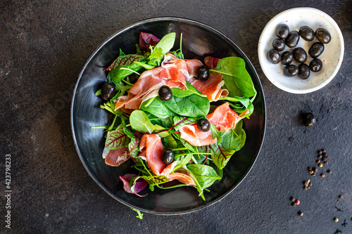 salad jamon prosciutto green leaves mix lettuce olives vegetables meat snack healthy meal top view copy space food background rustic image