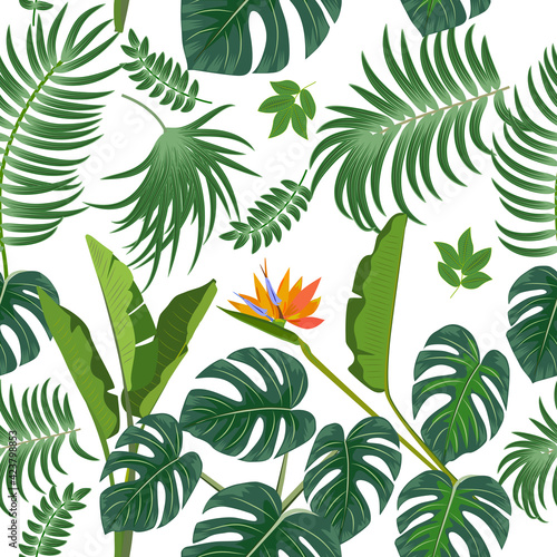 Vector tropical seamless pattern with leaves of palm tree and flowers