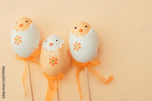 Easter eggs on beige pastel background family illustration