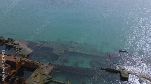 4K clip flying over a shipwreck in the  tropical beach of Epanomi, Norhtern Greece photo