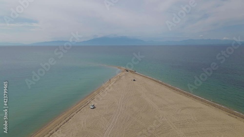 4k taking off clip over a peninsula on  the tropical beach of Epanomi, Halkidiki, Greece photo