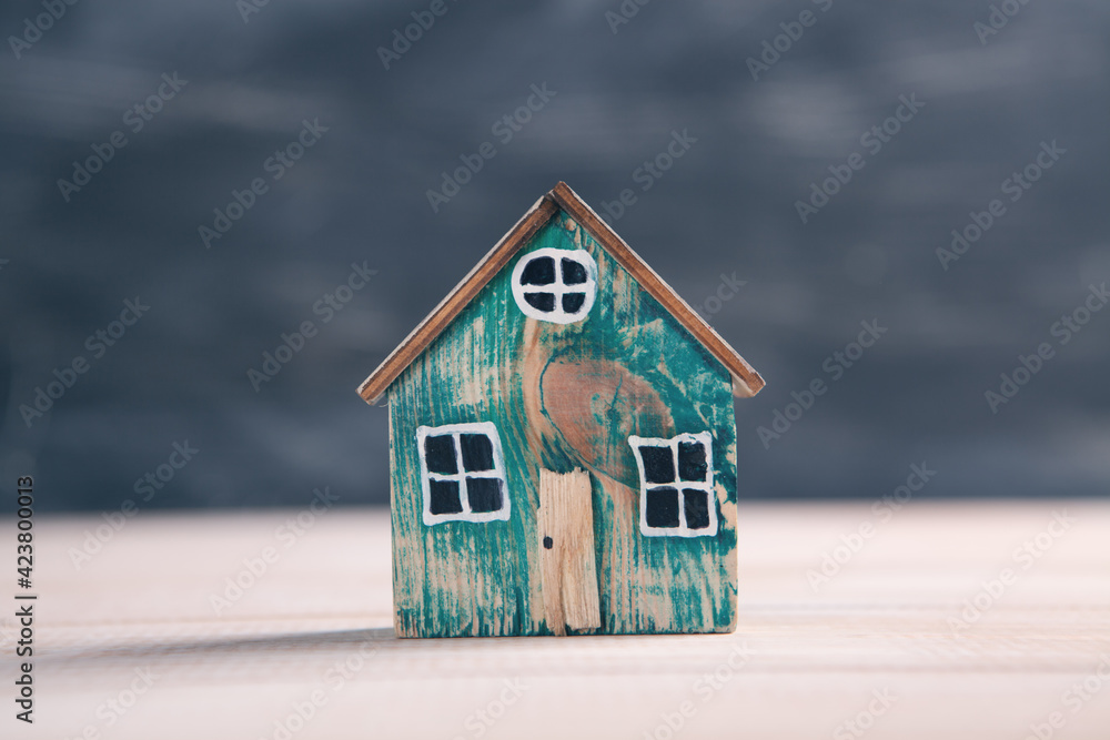 Family care and protection insurance concept. model of a small house Family care and protection insurance concept. model of a small house