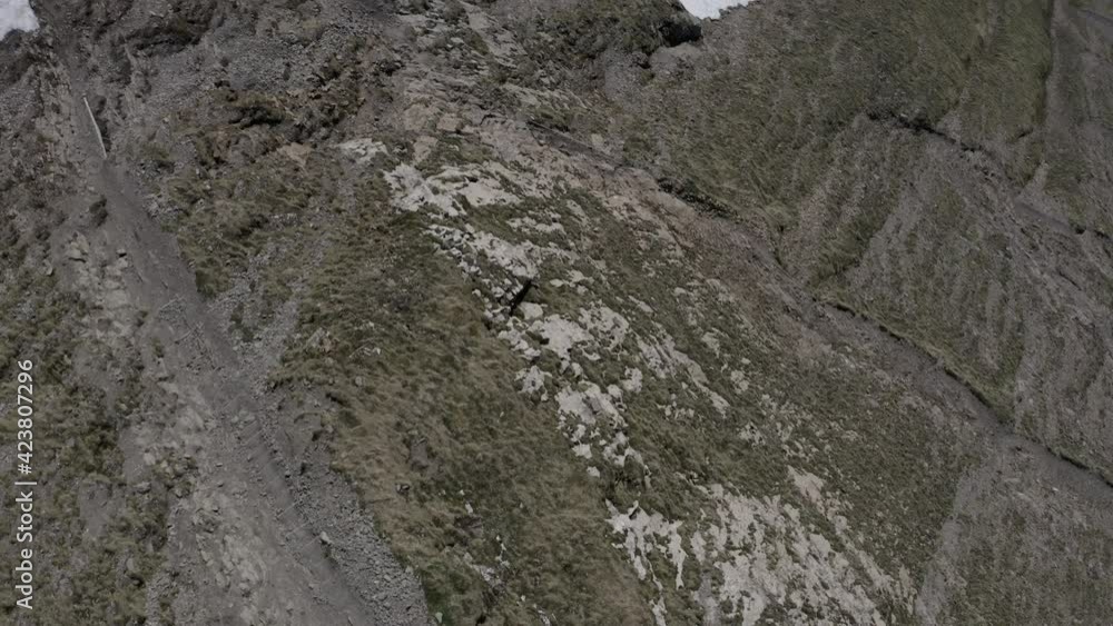 Aerial snowy mountain tops in the clouds Switzerland ungraded Aerial snowy mountain tops in the clouds Switzerland ungraded