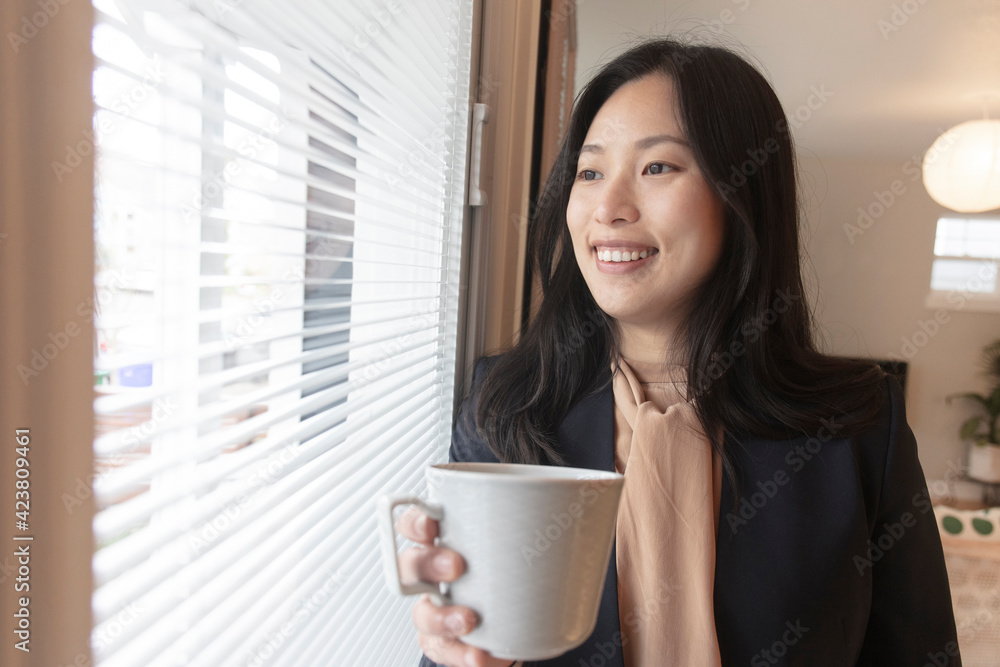 Asian female office worker doing household remote working at home Asian female office worker doing household remote working at home