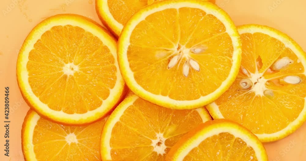 oranges slices rotate. Fresh citrus orange fruit close up. Super slow motion oranges slices rotate. Fresh citrus orange fruit close up. Super slow motion