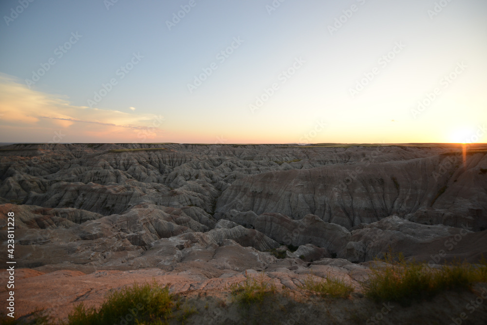 Landscape view of the unusual rock formations at Badlands National Park in South Dakota after sunset at twilight