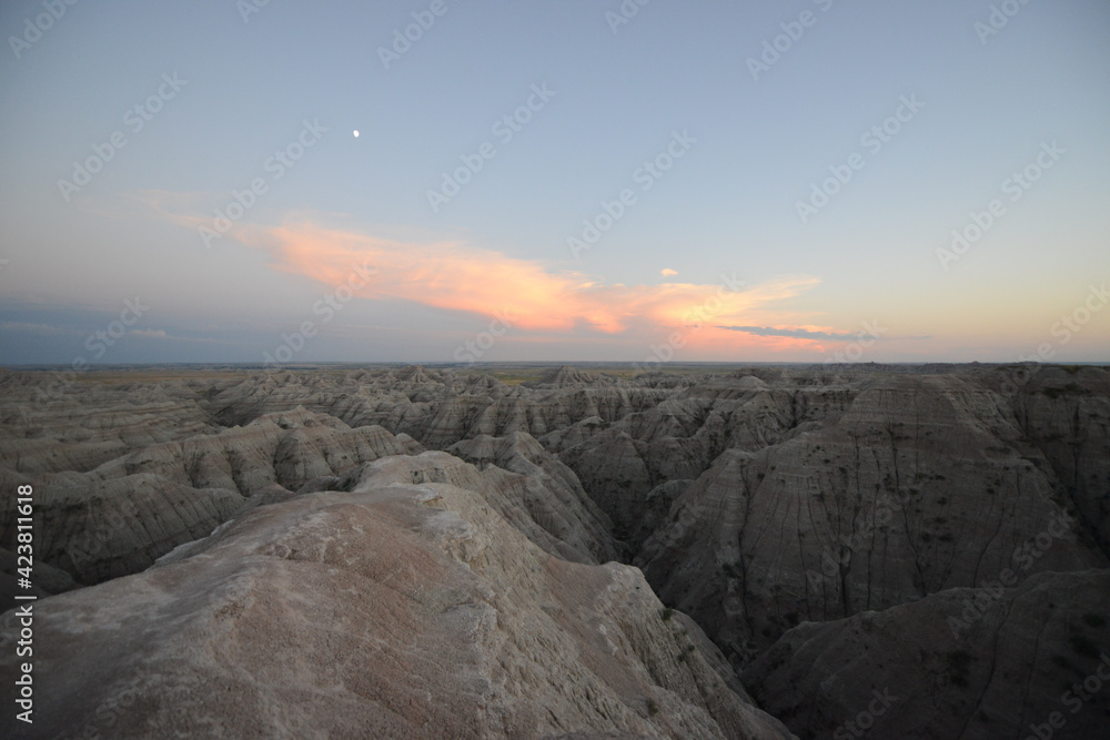 Landscape view of the unusual rock formations at Badlands National Park in South Dakota after sunset at twilight