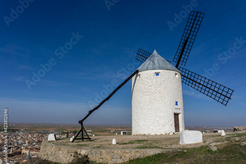 traditional whitewashed Spanish windmills in La Mancha on a hilltop above Consuegra