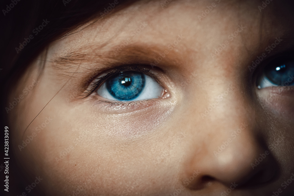 Blue eye of a three-year-old Caucasian girl. Close-up Blue eye of a three-year-old Caucasian girl. Close-up