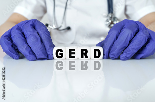 The doctor put together a word from cubes GERD. GASTRO-ESOPHAGEAL REFLUX DISEASE