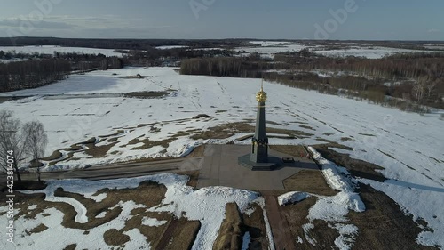 Borodino area and the main monument to Russian soldiers - heroes of the Borodino battle, Borodino, Russia. Aerial. Spring sunny day. Snow in the fields photo