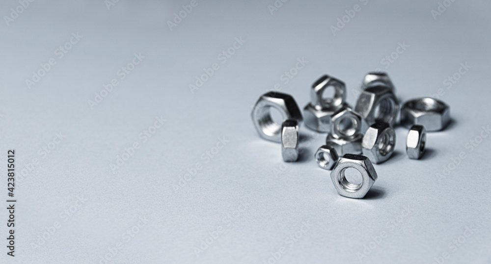 Big and small screw-nut. Concept. White background. Big and small screw-nut. Concept. White background.