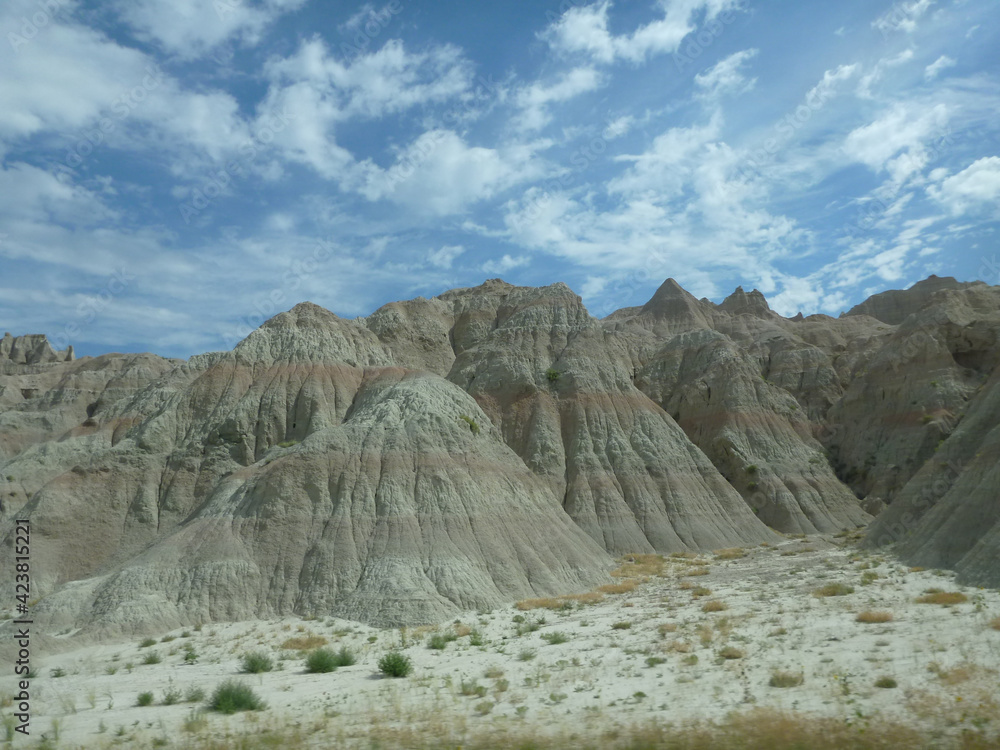 Fototapeta premium The surreal landscape and terrain at Badlands National Park in South Dakota