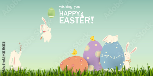Happy Easter. Easter Rabbit Bunny with eggs, grass, flowers in field. Cute cartoon rabbit character with chicken, Paschal egg. Design template for Banner, flyer, invitation, greeting card, poster.