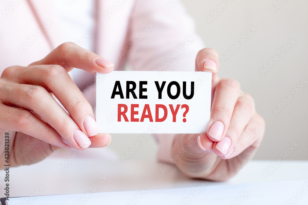 are you ready written on a card in woman hands are you ready written on a card in woman hands