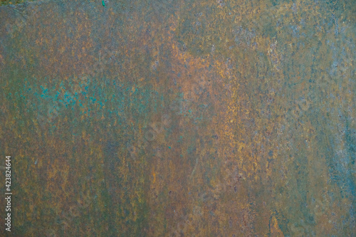Rusty metal wall. The old sheet of iron covered with rust. 