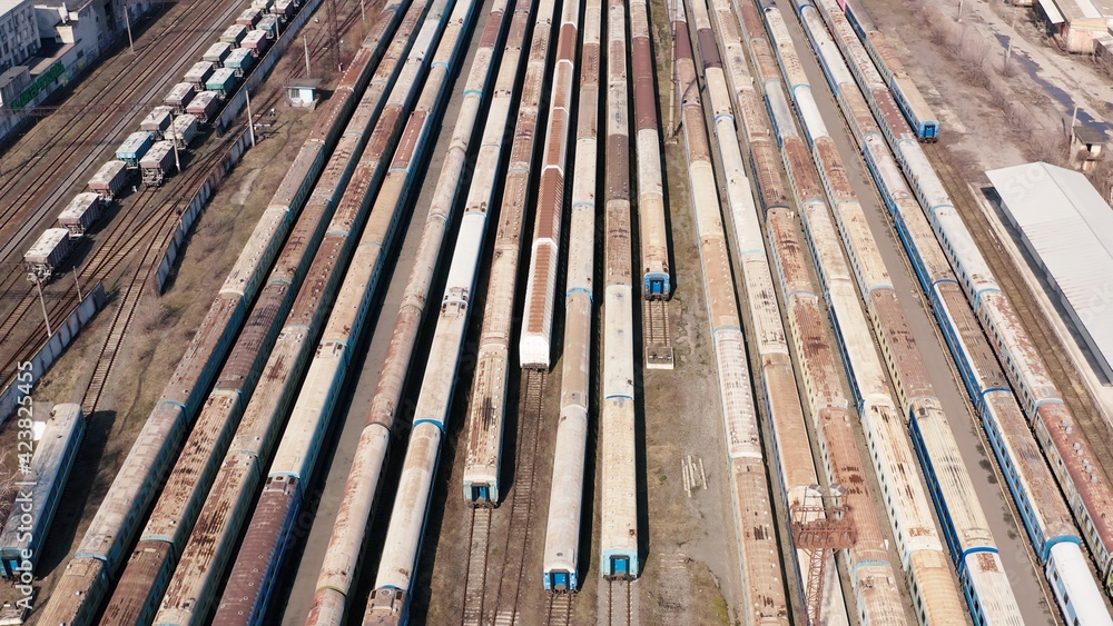 Railway hub showing passenger old crusty trains on tracks next to each other top down view drone moving slowly showing railway tracks positioned parallel. Old Railway Carriages and Wagons 4k Railway hub showing passenger old crusty trains on tracks next to each other top down view drone moving slowly showing railway tracks positioned parallel. Old Railway Carriages and Wagons 4k