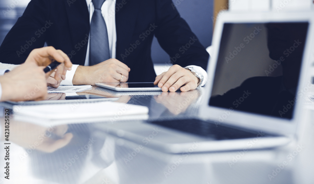 Business people working together at meeting in a modern office. Unknown businessman and woman with colleagues or lawyers at negotiation about contract Business people working together at meeting in a modern office. Unknown businessman and woman with colleagues or lawyers at negotiation about contract