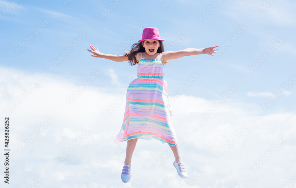 happy child jump in summer dress on sky background, freedom happy child jump in summer dress on sky background, freedom