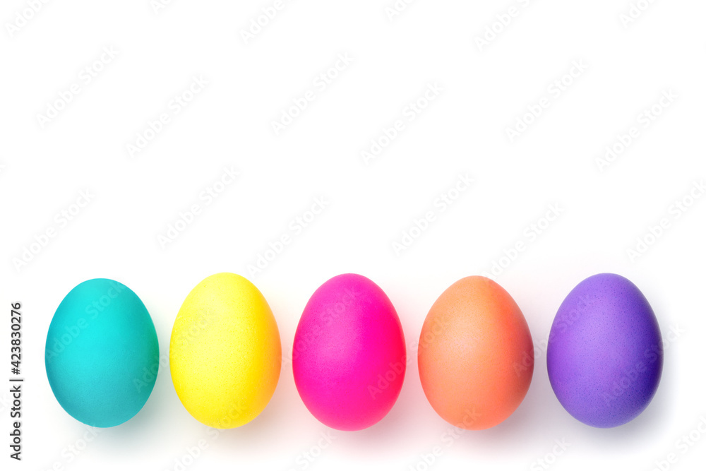 Multi-colored holiday eggs. Eggs on a white background for a postcard