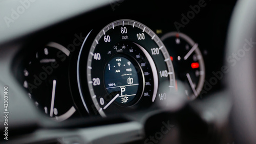 Modern car miles Speedometer close up.