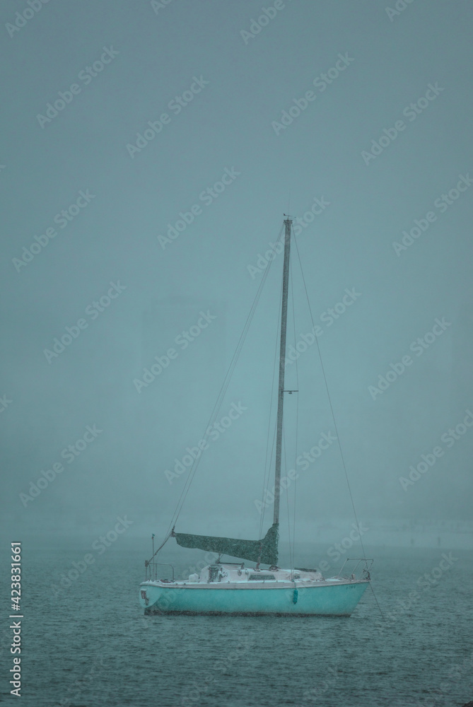 sailboat on the sea in winter
