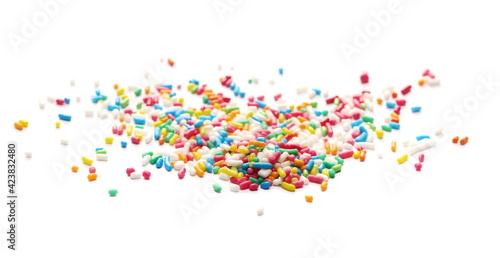 Pile colorful candy sprinkles isolated on white background, side view