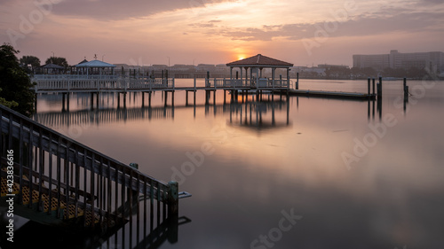 Stairs on a public access area of Harbor Island lead down to the still water of the banks channel at sunrise. Space for copy 