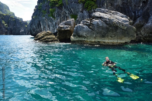 Diver at El Nido Palawan Paradise in the Philippines, Island hopping, dive spot, beautiful beaches ,cliffs, nature © SimonMichael
