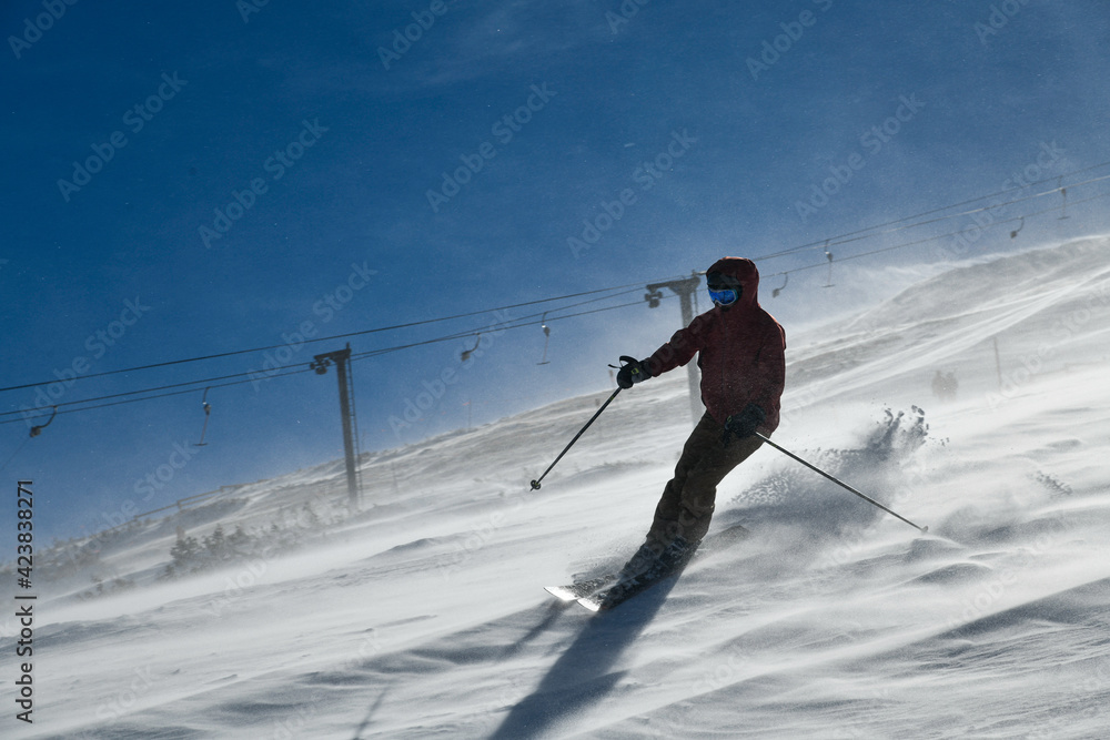 Woman skiing on snowy hill at Breckenridge ski resort. Extreme winter sports. Action shot. Breckenridge , CO