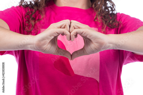 Smiling positive young woman with pink shirt