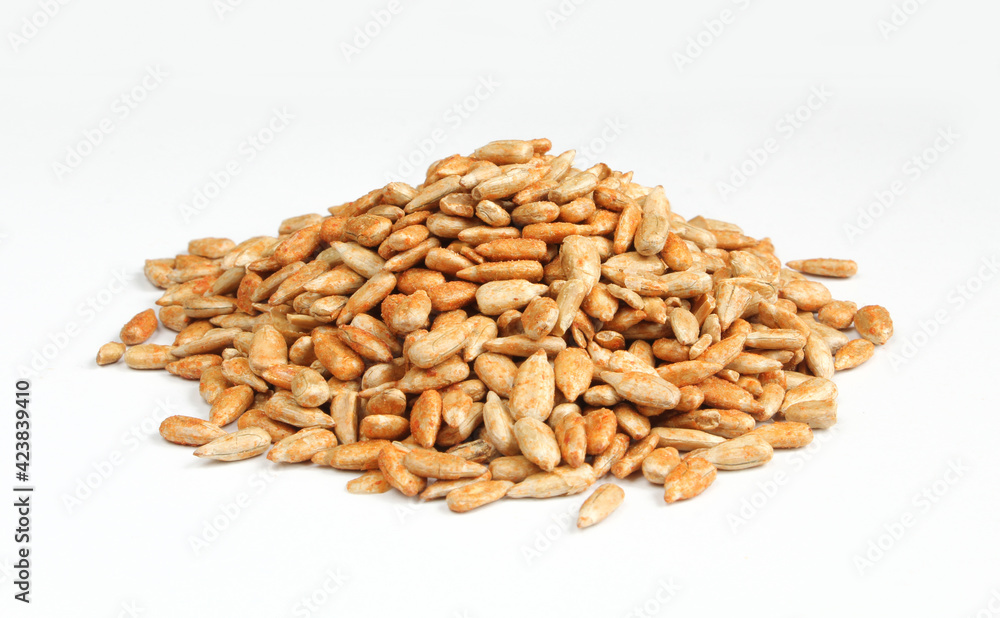 Pile of roasted sunflower seed marinated with paprika isolated on white background Pile of roasted sunflower seed marinated with paprika isolated on white background