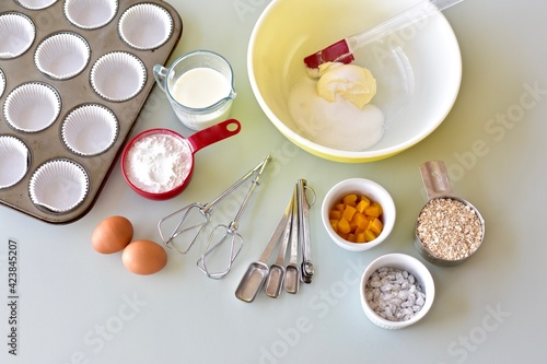 Baking ingredients and kitchen utensils for making healthy gourmet muffins and baked goods. Photo concept, food background, copy space, flay lay, close-up