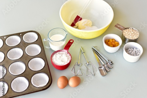 Baking ingredients and kitchen utensils for making healthy gourmet muffins and baked goods. Photo concept, food background, copy space, flay lay, close-up