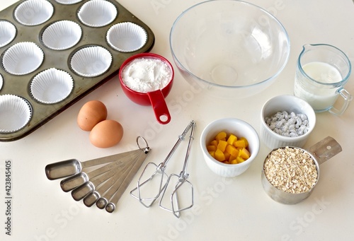 Baking ingredients and kitchen utensils for making healthy gourmet muffins and baked goods. Photo concept, food background, copy space, flay lay, close-up