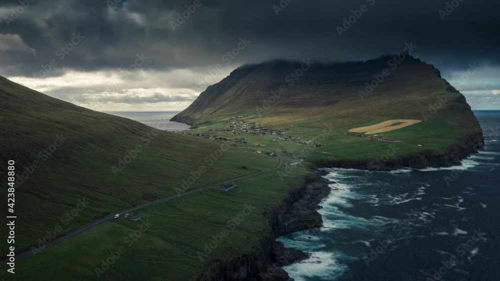 Time lapse from above of dark rain clouds over mountain Cape Enniberg on Vidoy, waves along the coast, Faroe Islands
Time lapse from above of dark rain clouds over mountain Cape Enniberg on Vidoy, waves along the coast, Faroe Islands