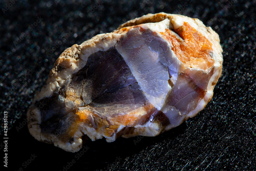 Raw agate quartz minerals nugget from Novy Urengoy, Russia. A backlight photo of stone isolated on black. Geology minerology websites, stone collection catalog, Natural Science museum wall chart Raw agate quartz minerals nugget from Novy Urengoy, Russia. A backlight photo of stone isolated on black. Geology minerology websites, stone collection catalog, Natural Science museum wall chart