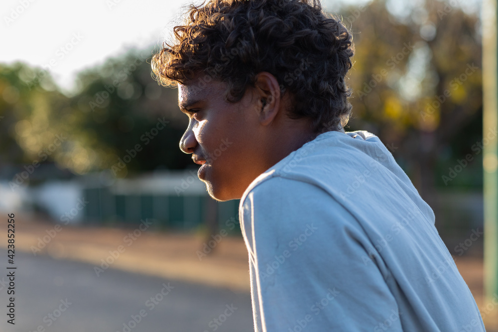 head and shoulders of aboriginal boy in profile head and shoulders of aboriginal boy in profile