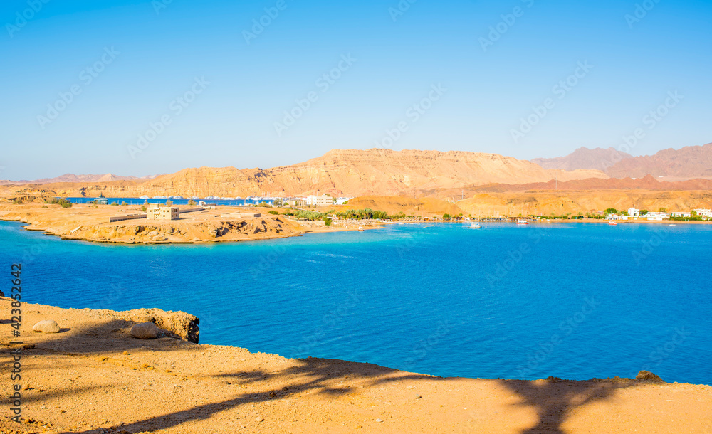 beautiful panoramic views of Sharm El Maya Bay, Hadaba in Sharm El Sheikh, Egypt, South Sinai, with clear blue sea and sun-drenched cliffs