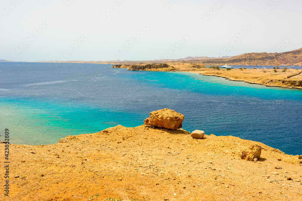 beautiful panoramic views of Sharm El Maya Bay, Hadaba in Sharm El Sheikh, Egypt, South Sinai, with clear blue sea and sun-drenched cliffs