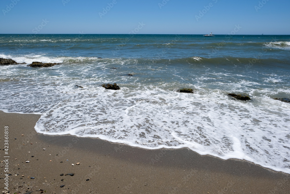 CALAHONDA, ANDALUCIA/SPAIN - JULY 2 : Beach at Calahonda Costa del Sol Spain on July 2, 2017 CALAHONDA, ANDALUCIA/SPAIN - JULY 2 : Beach at Calahonda Costa del Sol Spain on July 2, 2017