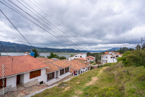 typical street of the village of Guatavita and Tomine Reservoir, Cundinamarca, Colombia photo