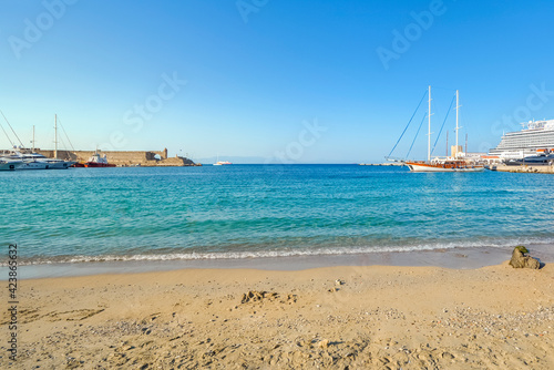 An empty Elli Beach near the Old Town gates and the cruise port on the island of Rhodes  Greece.